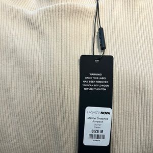 Cream Ribbed Jumpsuit. Size Medium.